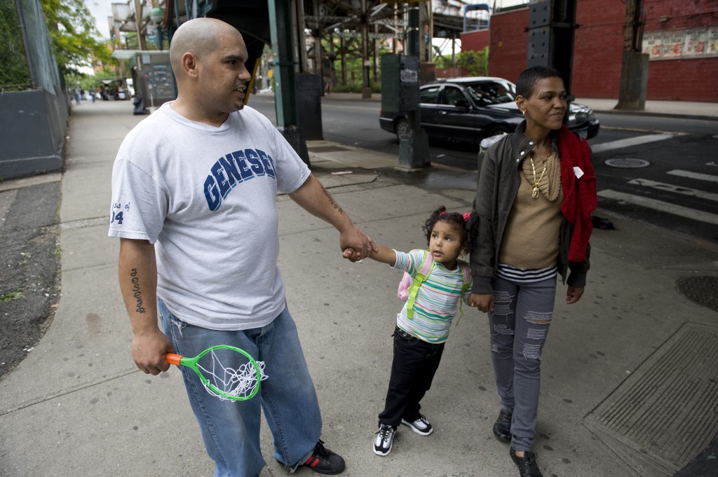 For RWJF "Keeping Families Together" BRONX, NEW YORK - MAY 19: Jose Soto, his wife, Evelyn, and their daughter Destiny, 3, spend time together in their apartment and neighborhood in the Bronx, New York May 19, 2010.
