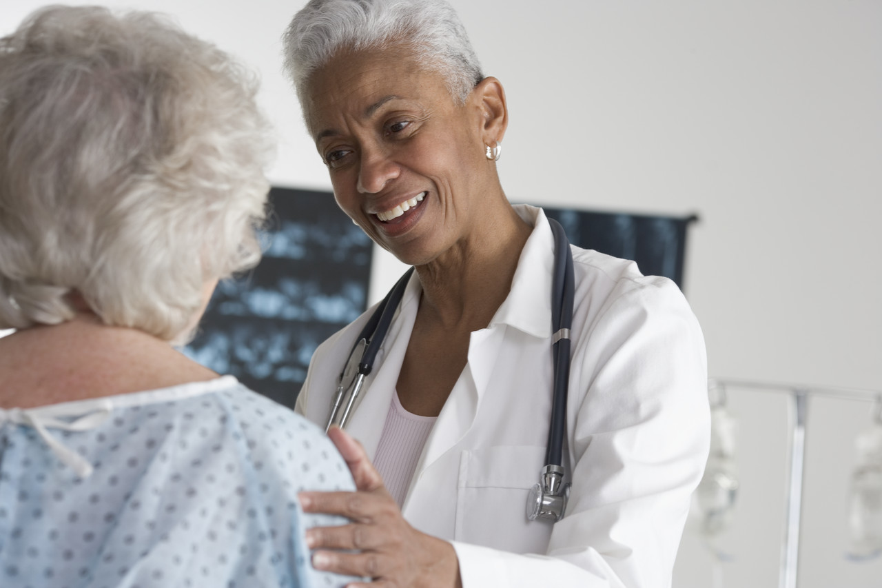 Doctor Speaking with Patient