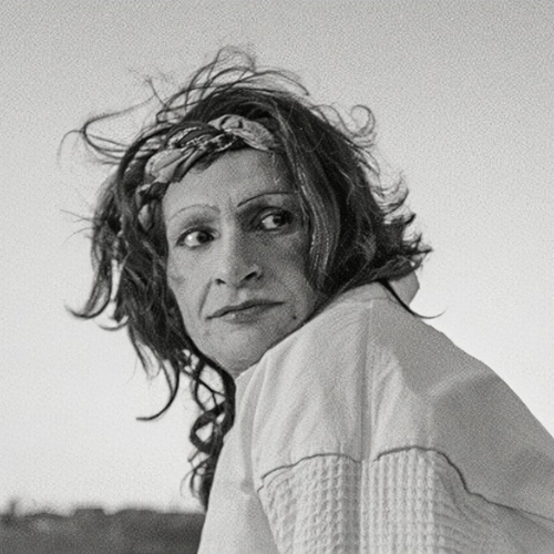 A black and white photo of Sylvia Rivera looking to the right 