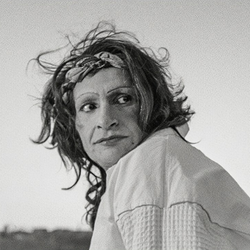 A black and white photo of Sylvia Rivera looking to the right