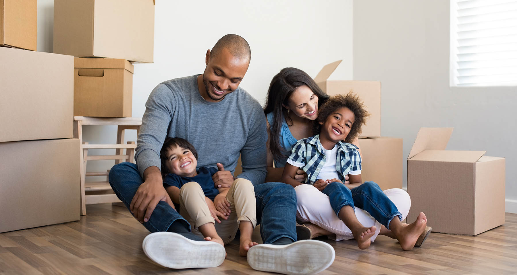family with moving boxes around them
